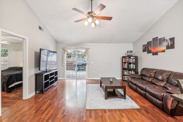 living room featuring dark hardwood / wood-style floors, high vaulted ceiling, plenty of natural light, and ceiling fan