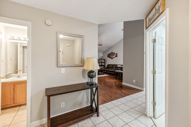 hallway featuring light hardwood / wood-style floors and sink