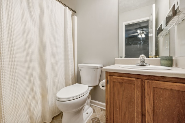 bathroom featuring tile patterned floors, vanity, and toilet