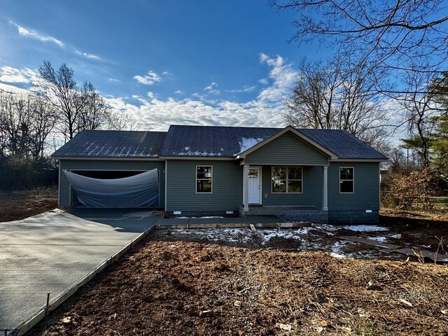 single story home featuring a carport