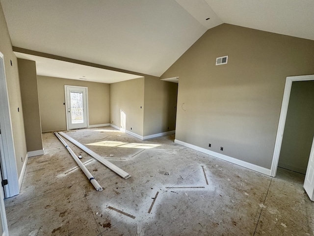 spare room featuring vaulted ceiling