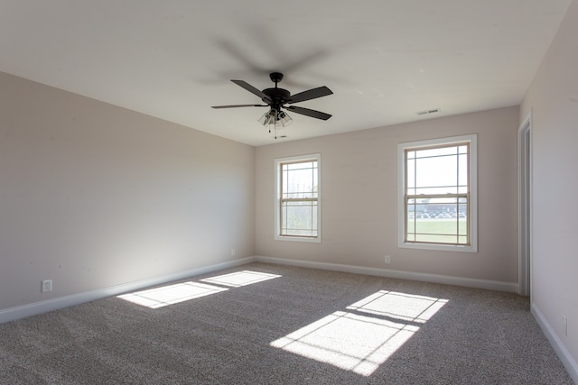 unfurnished room with carpet flooring and ceiling fan