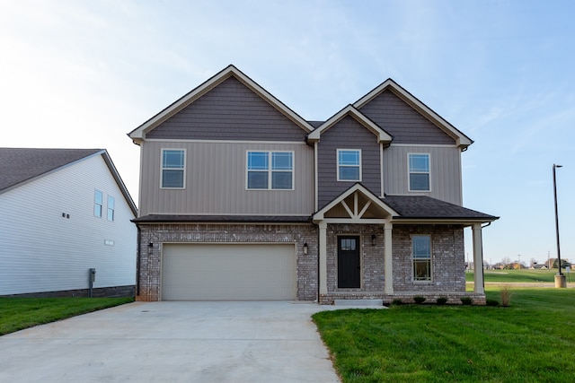 craftsman-style house featuring a front yard and a garage