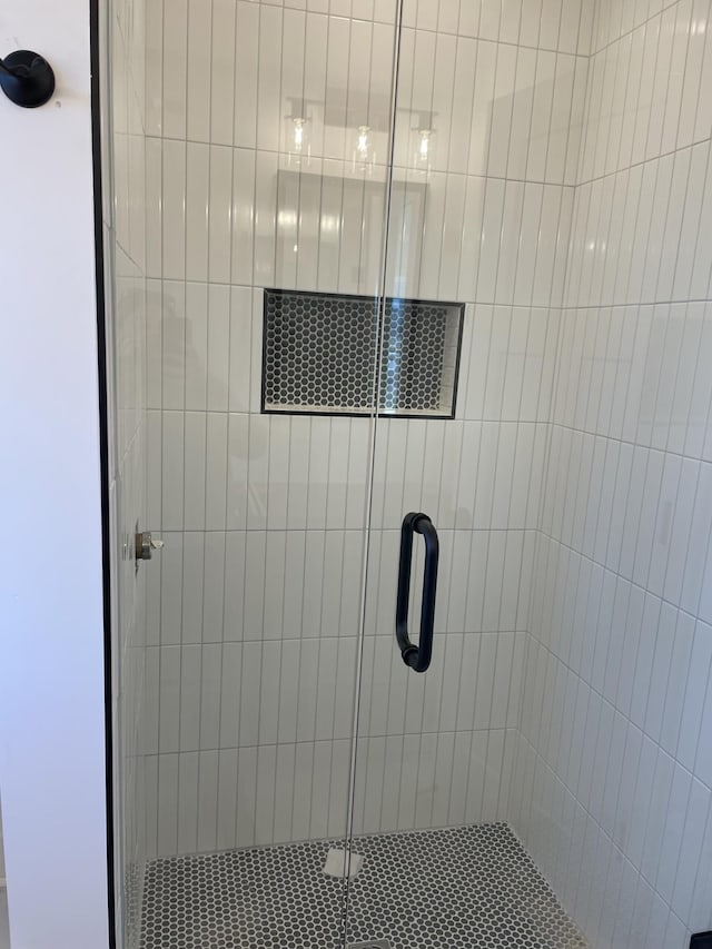 bathroom featuring an enclosed shower