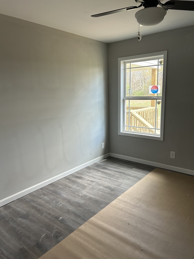 unfurnished room with wood-type flooring and ceiling fan