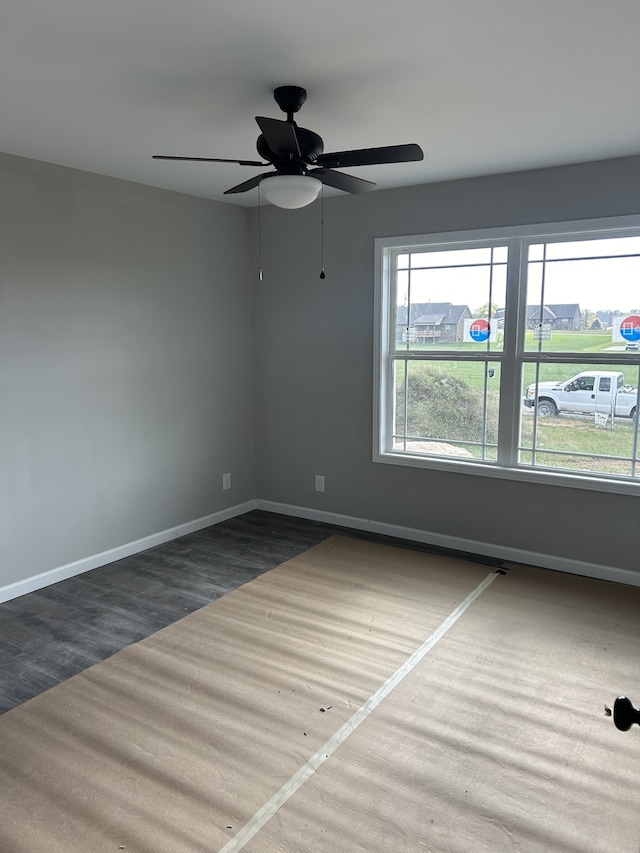 unfurnished room with dark hardwood / wood-style floors