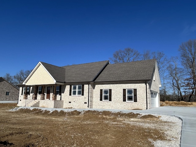 view of front facade featuring a garage and a porch