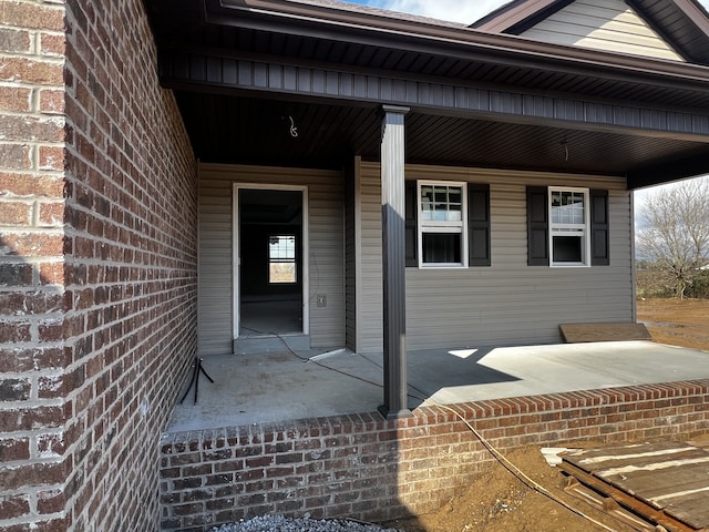 property entrance with covered porch