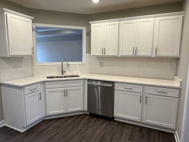 kitchen with sink, white cabinets, stainless steel dishwasher, and dark hardwood / wood-style floors