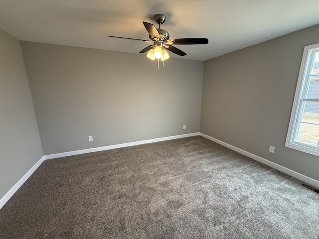 carpeted empty room with ceiling fan