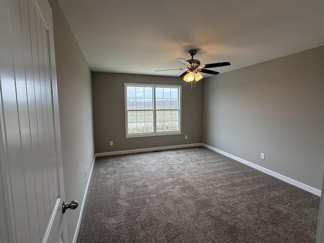 carpeted empty room with ceiling fan