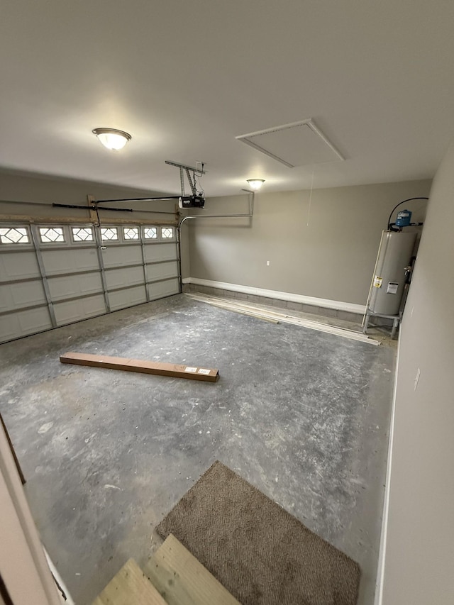 garage featuring a garage door opener and water heater