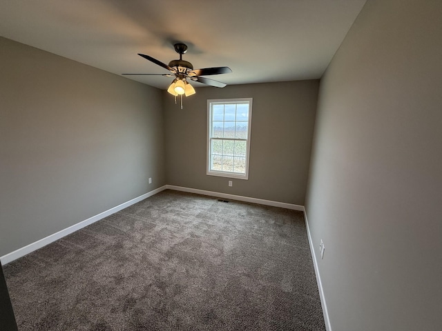 carpeted empty room with ceiling fan