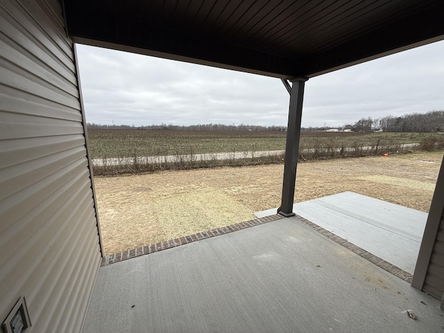 view of patio with a rural view