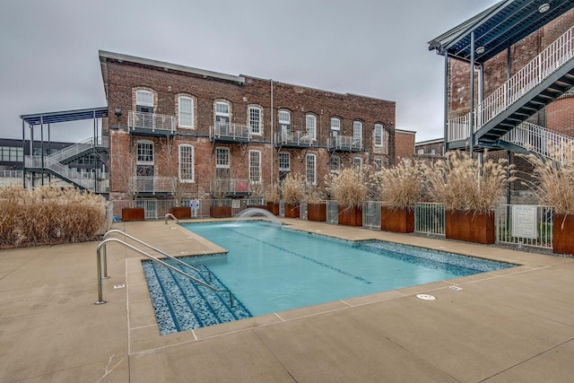community pool featuring fence