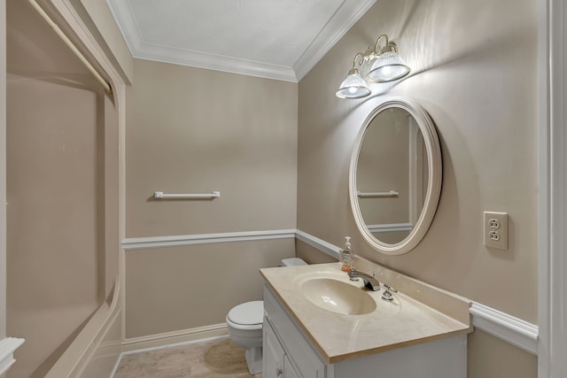 bathroom with vanity, toilet, and crown molding