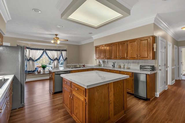 kitchen with a center island, dark hardwood / wood-style flooring, ornamental molding, and stainless steel appliances