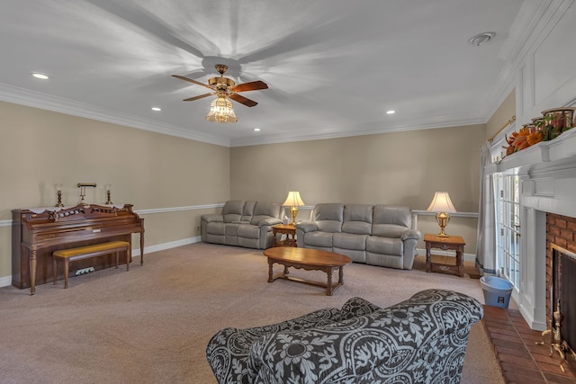 carpeted living room featuring a brick fireplace, ceiling fan, and crown molding