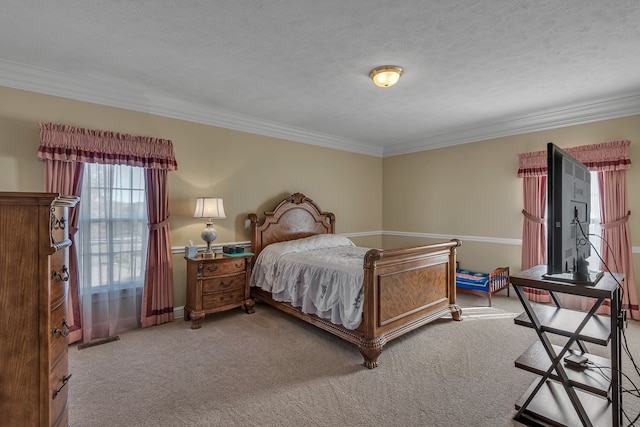 bedroom with crown molding, light colored carpet, and a textured ceiling