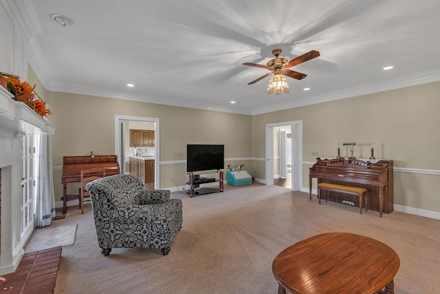 carpeted living room featuring a brick fireplace, ceiling fan, and crown molding