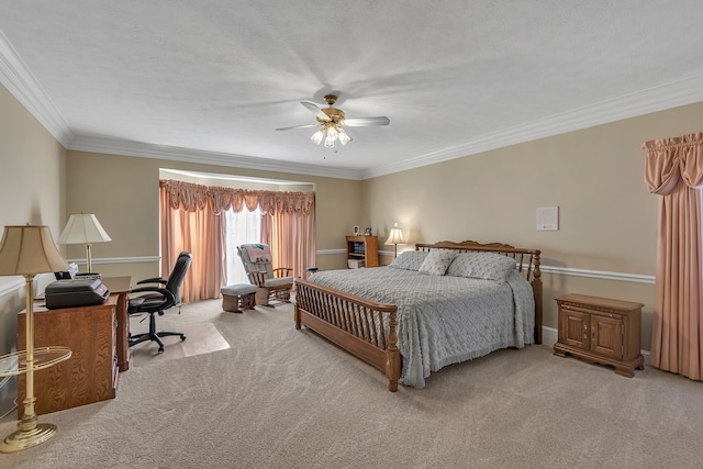 carpeted bedroom featuring ceiling fan, ornamental molding, and a textured ceiling