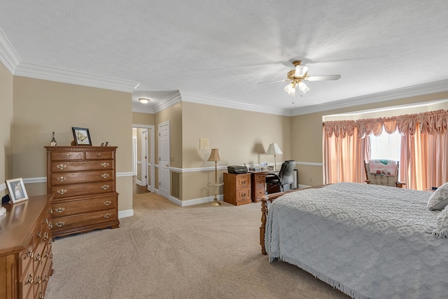 carpeted bedroom with a textured ceiling, ceiling fan, and crown molding