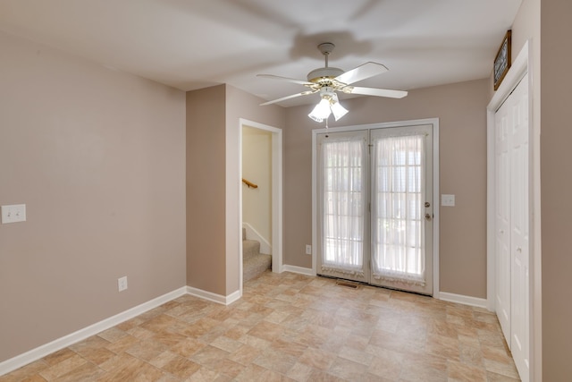 doorway with ceiling fan