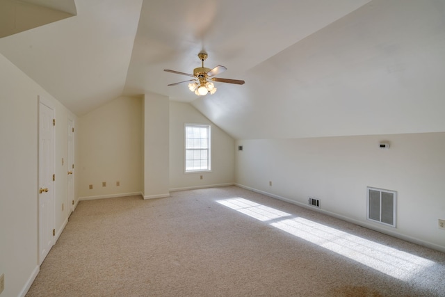 bonus room with ceiling fan, light colored carpet, and vaulted ceiling