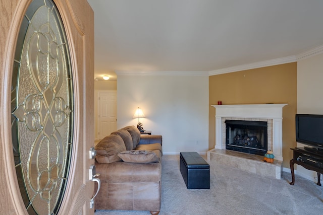 carpeted living room featuring crown molding and a tile fireplace