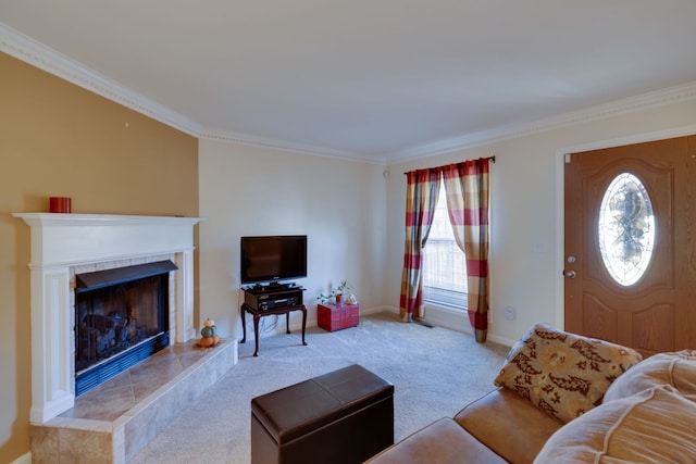 living room with a tile fireplace, crown molding, and light carpet