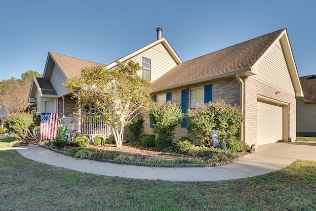 view of front of home with covered porch and a garage