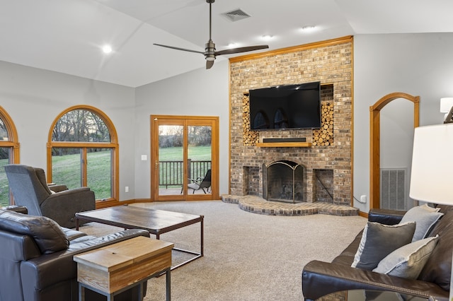 carpeted living room with a fireplace, high vaulted ceiling, and ceiling fan