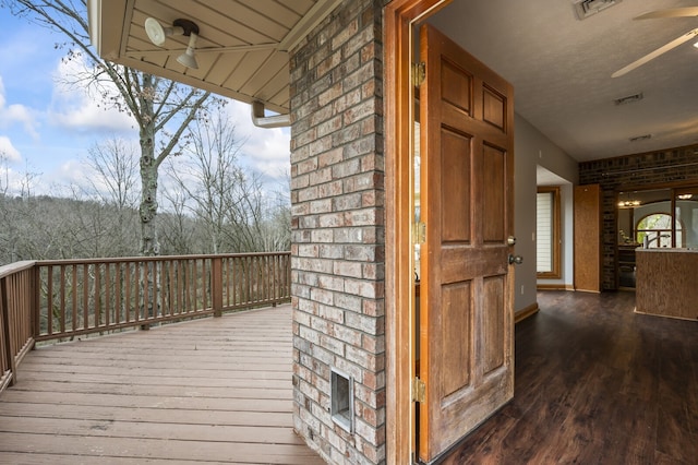 wooden terrace with ceiling fan