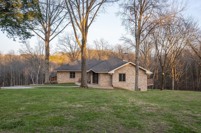 view of front of property with a patio and a front lawn