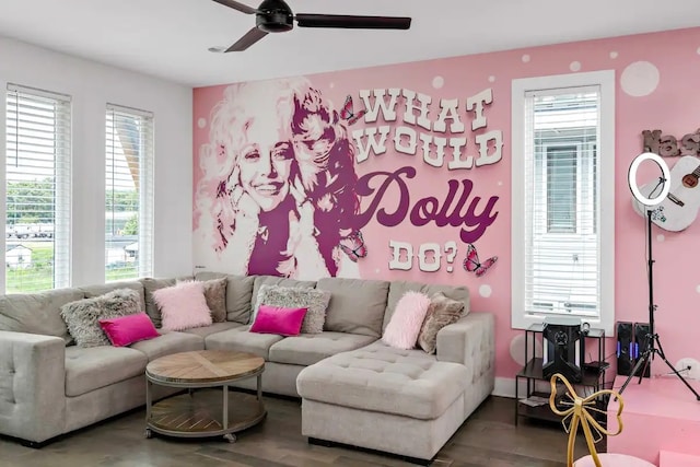 living room featuring wood-type flooring and ceiling fan