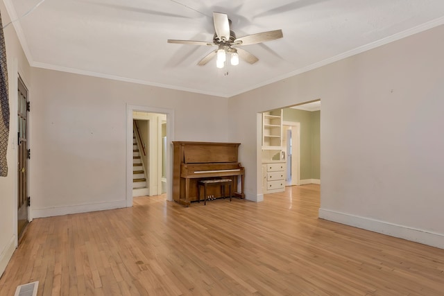 unfurnished living room with crown molding, ceiling fan, and light wood-type flooring