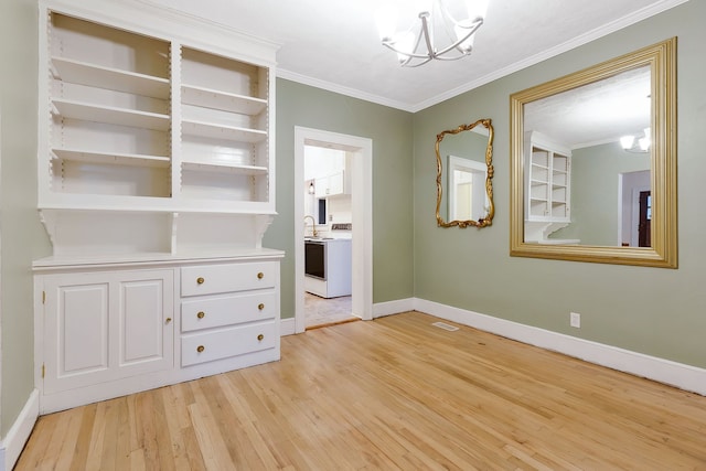 unfurnished bedroom with a notable chandelier, crown molding, and light hardwood / wood-style flooring