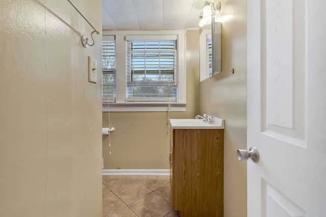 bathroom with tile patterned flooring and vanity