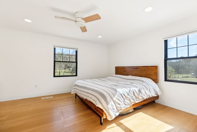 bedroom featuring wood-type flooring and ceiling fan