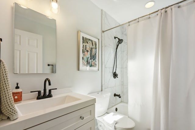 full bathroom featuring vanity, shower / bath combo, and toilet