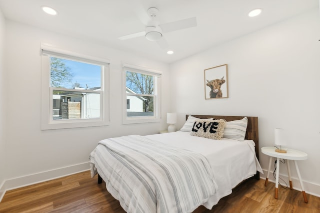 bedroom featuring dark hardwood / wood-style flooring and ceiling fan