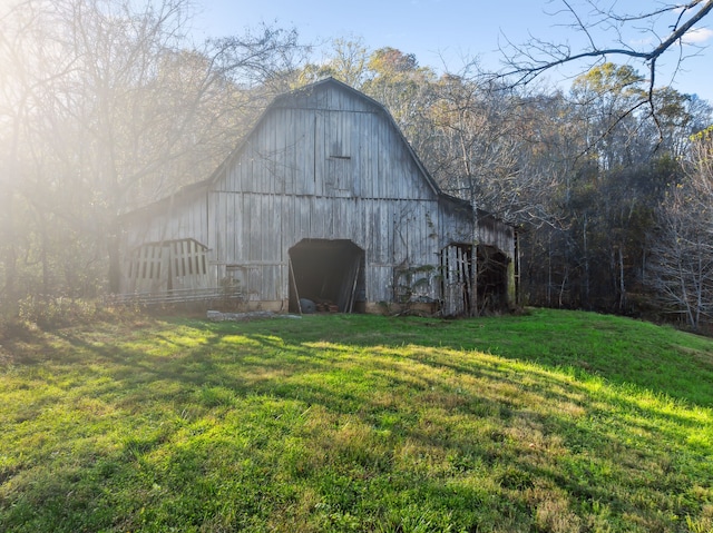 view of outdoor structure with a lawn