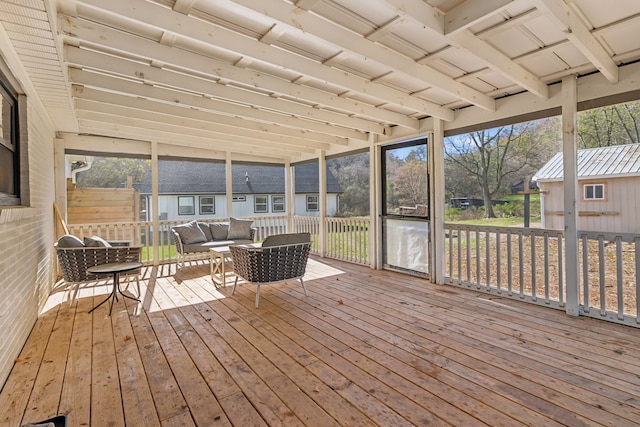 sunroom / solarium featuring plenty of natural light