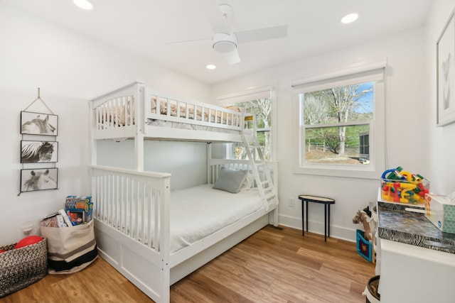 bedroom featuring light hardwood / wood-style flooring and ceiling fan