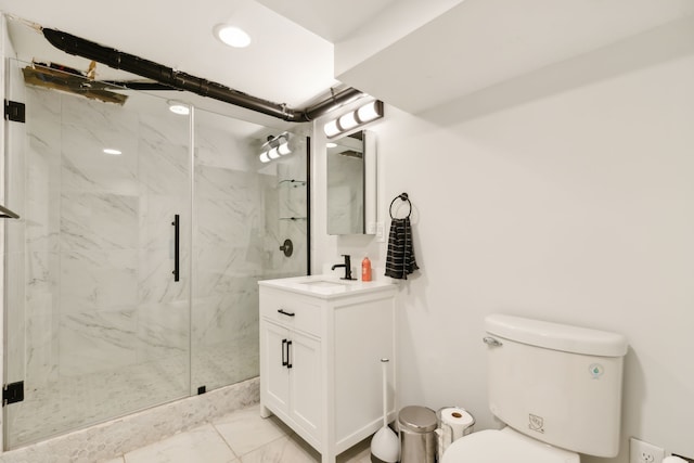 bathroom with vanity, an enclosed shower, and toilet