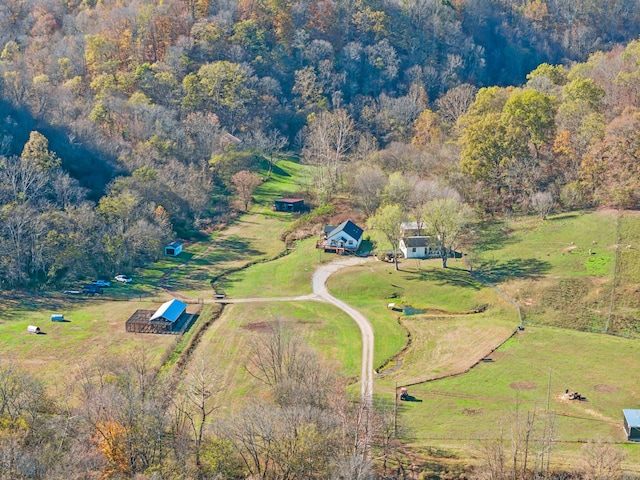 birds eye view of property with a rural view