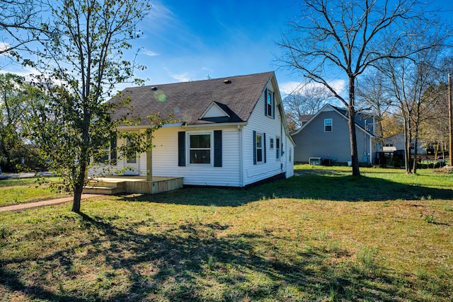 view of side of home featuring a lawn