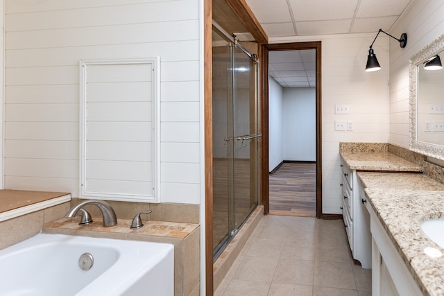 bathroom featuring tile patterned flooring, vanity, a paneled ceiling, and shower with separate bathtub