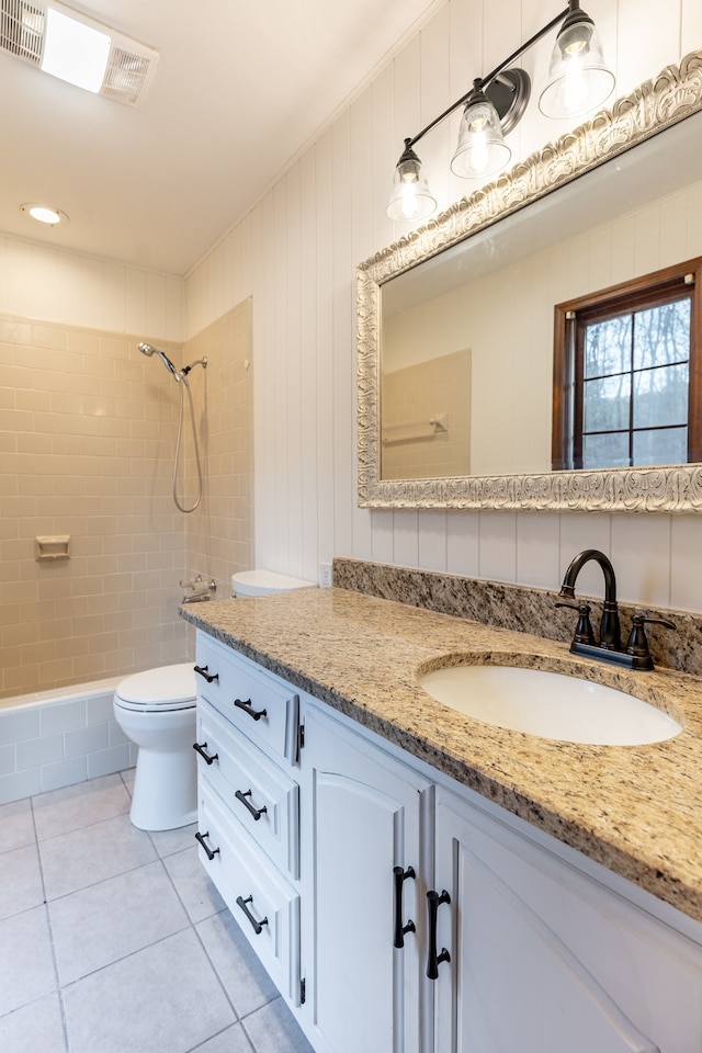 bathroom featuring toilet, vanity, and tile patterned floors