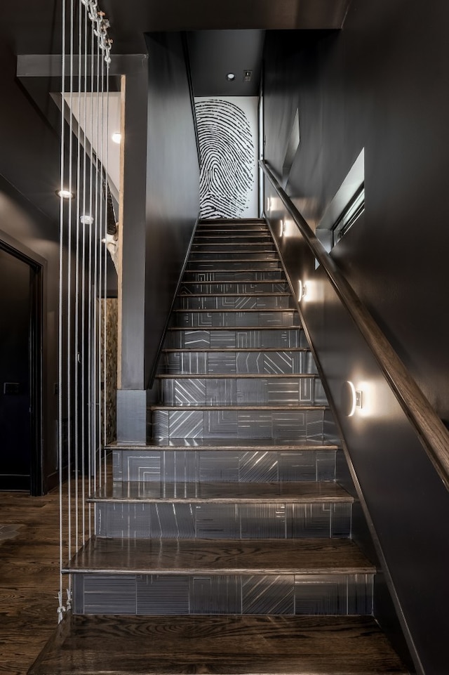 staircase featuring hardwood / wood-style flooring